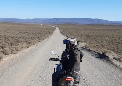 Adventure rider stopped on a remote gravel road in South Africa.