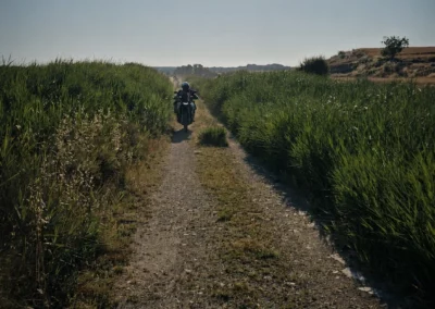 Adventure rider on a narrow countryside trail in Portugal.