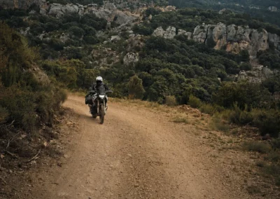 Adventure rider on a mountain dirt road in Portugal.